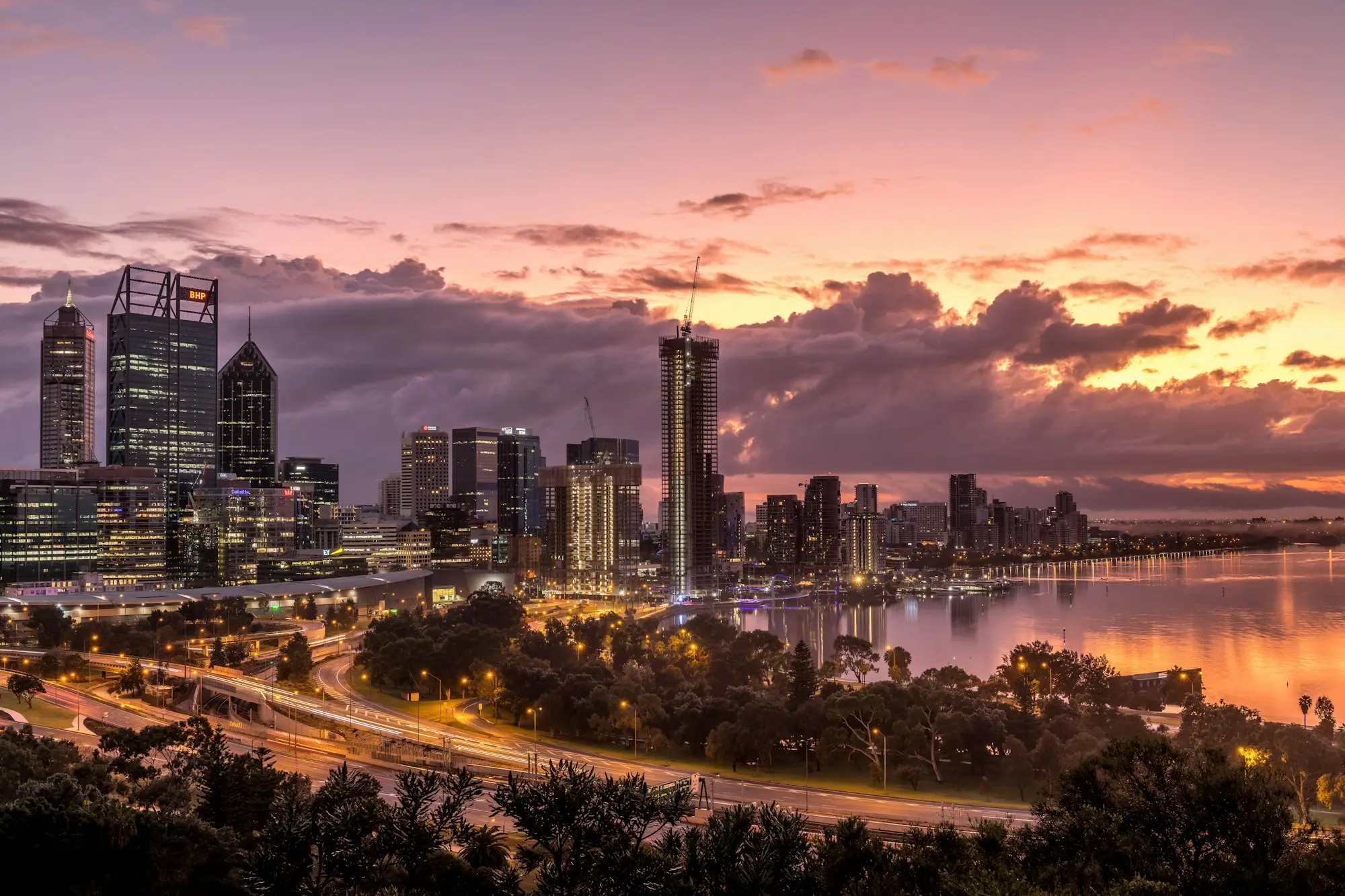 Perth city skyline over the river at sunset